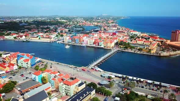 Truck right aerial view of the Otrobanda and Punda districts of Willemstad, Curacao, Dutch Caribbean