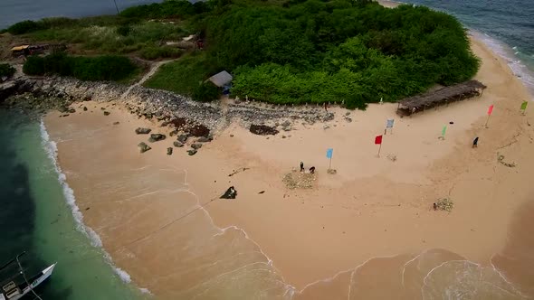 Aerial drone video of an exotic white sand tropical island in the Southeast Asia