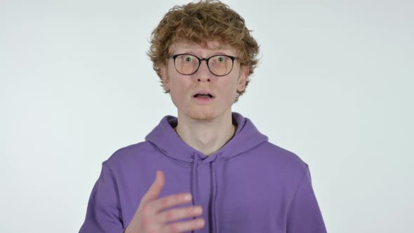 Redhead Young Man with Shocked Expression, White Background