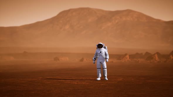 Astronaut on Mars Surface. Red Planet Covered in Gas and Rock