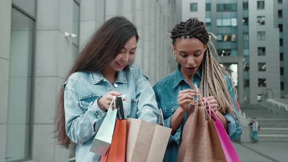 Two Female Friends with Multicolored Bags