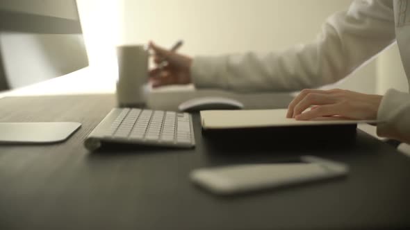 Worker With Computer And Notebook