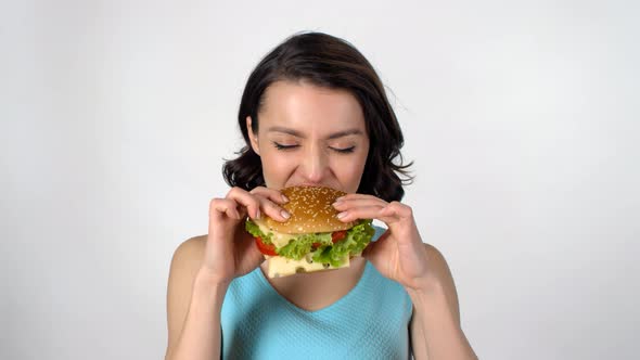 Young Woman Enjoying Burger