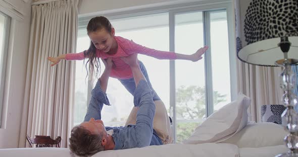 Father lifting up her daughter 4k