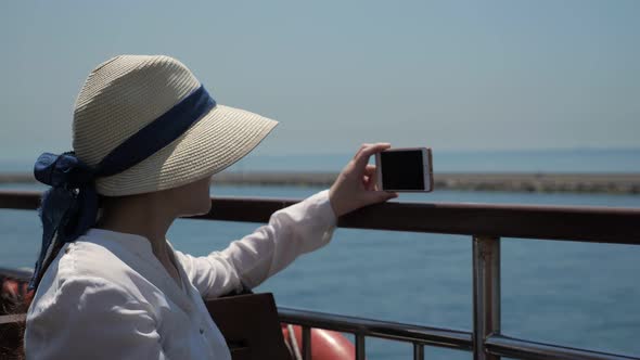 Lady Makes Video of Beautiful Seascape Sailing Past Pier