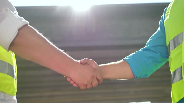 Close Up of Handshake in Construction Site