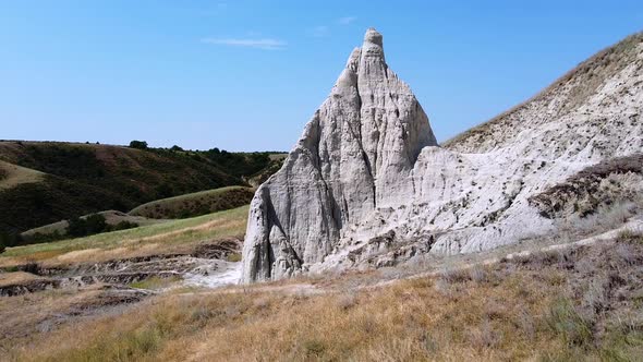 A cone shaped hill. High limestone pillar, chalk mountain