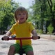 Happy boy rides a bike in the park. - VideoHive Item for Sale