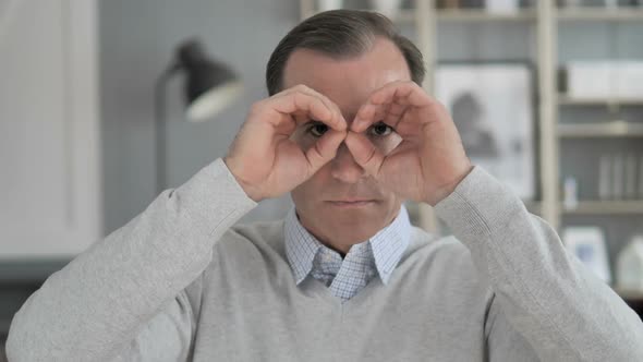 Handmade Binocular Gesture By Middle Aged Man Searching New Chance