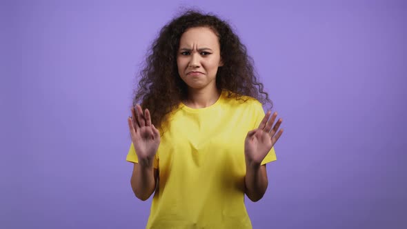 Portrait of Woman Showing Rejecting Gesture By Stop Finger Sign