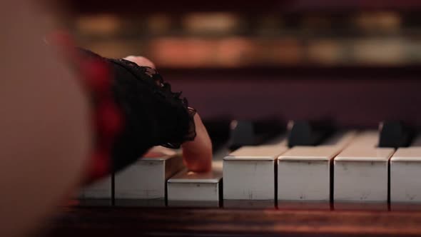 Woman Playing on Vintage Wooden Piano