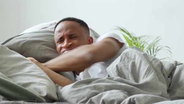 Young Afro-american Man Meeting Dawn in Bed, Suffering From Insomnia