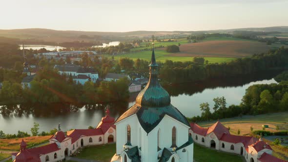 Moving Backwards Above the Pilgrimage Church of Saint John of Nepomuk on the Green Hill at Sunset