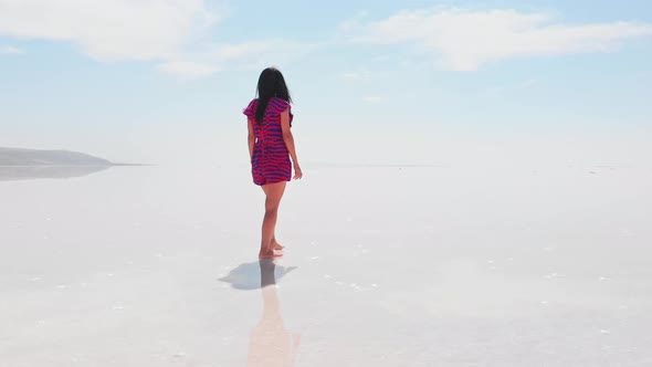 Woman Walks Barefoot On Salt Lake