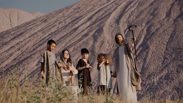 Jesus and Mary are Standing on a Hill Showing Children Something in the Distance