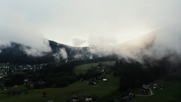 Panoramic View of a Picturesque Mountain Valley with a Village in a Lowland