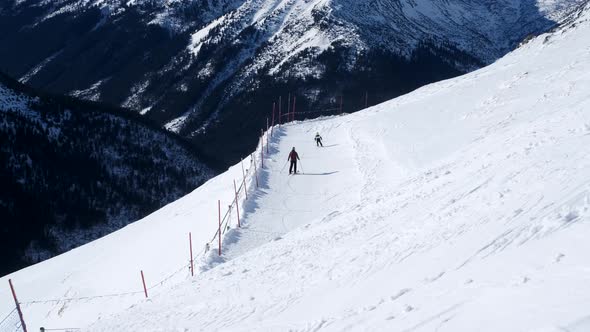 Skiers are Skiing on the Slopes in the Mountains Mountain Ski Run  60p