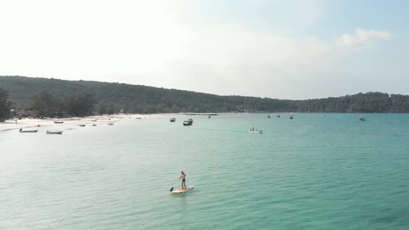 Wooden Traditional Cambodia Boats moored on the shallow exotic waters. Saracen Bay, Koh Rong Sanloem