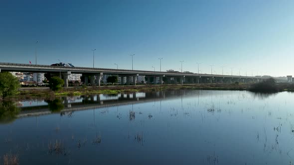 Traffic in the reflection of water aerial view 4 K Turkey Antalya Side