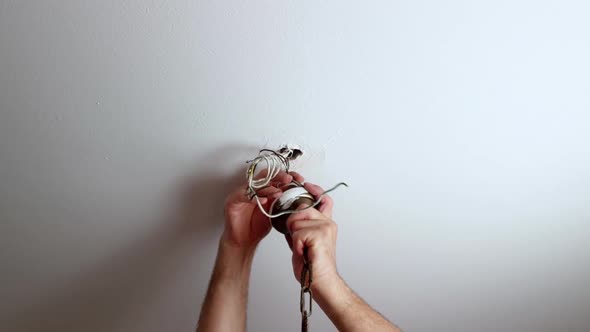 Disconnecting a chandelier from the ceiling