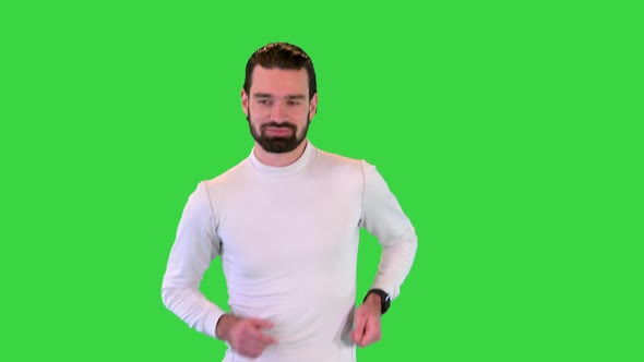 Handsome Confident Male Runner Jogging on a Green Screen Chroma Key