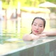 Young asian woman enjoy around outdoor swimming pool for leisure - VideoHive Item for Sale