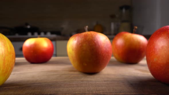 Ripe apples on a wooden board 