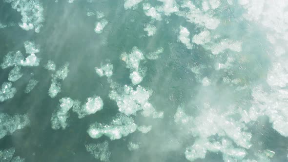 drift ice flowing down the snowy river