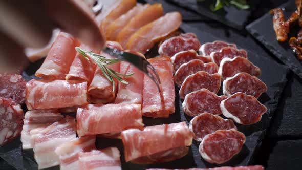 Salami and Chorizo Sausage Close Up on Stone Serving Board