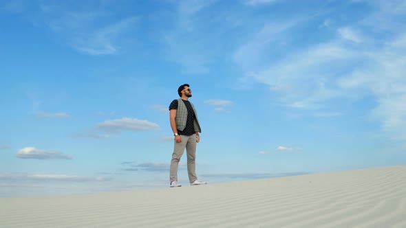 Man Traveling in Desert