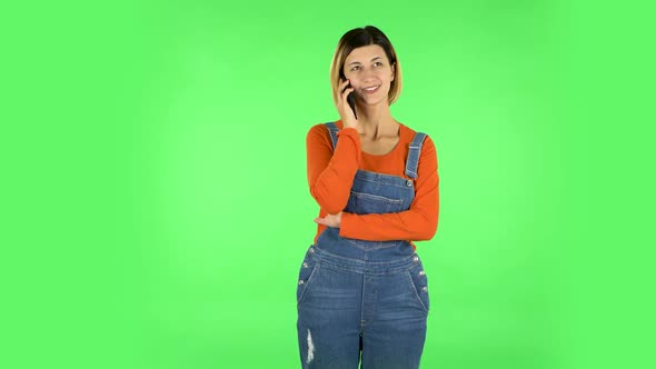 Smiling Girl Talking for Mobile Phone. Green Screen