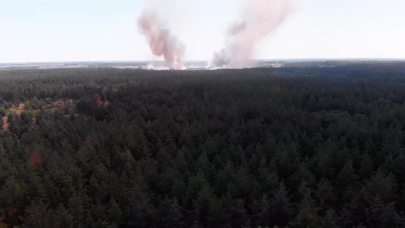 Aerial View of Fire in Wheat Field. Flying Over Smoke Above Agricultural Fields