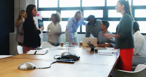 Time lapse of business executives during a meeting in conference room