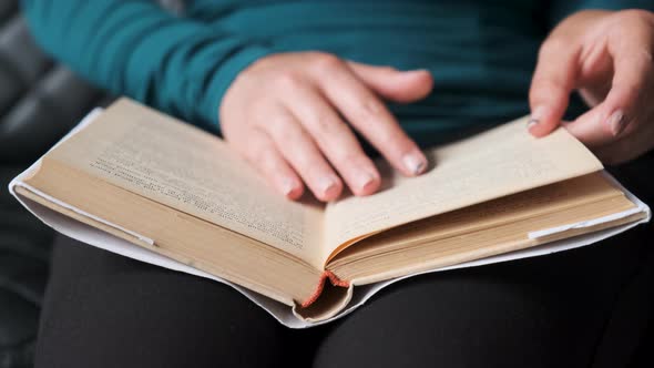 Young Girl Reading Book. Close-up Book Reading