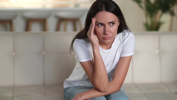Disappointed Unhappy Caucasian Young Woman Sitting on the Sofa in the Living Room She Has Personal