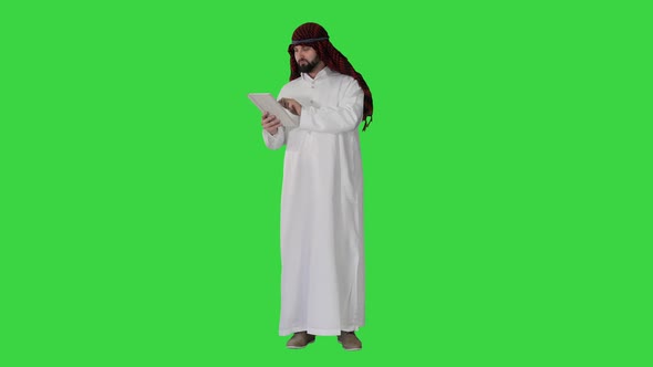 Arabic Business Man with Tablet on a Green Screen, Chroma Key.