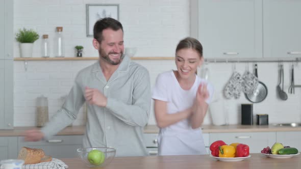 Man and Woman Dancing in Kitchen