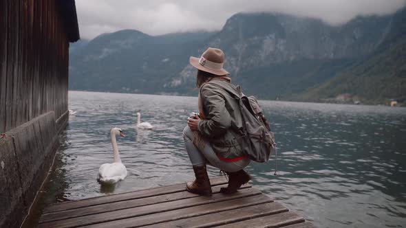 Young photographer with swans