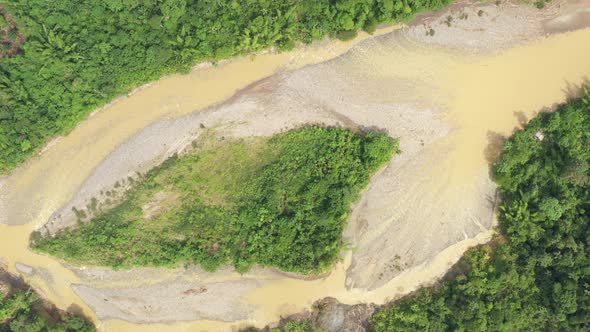 Bird eye view of a large river in which the camera turns around at two different speeds