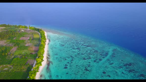 Aerial top down seascape of beautiful tourist beach journey by blue ocean with clean sandy backgroun