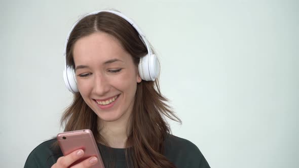 Portrait of Attractive Cheerful Woman Listening Single Hit Using Device