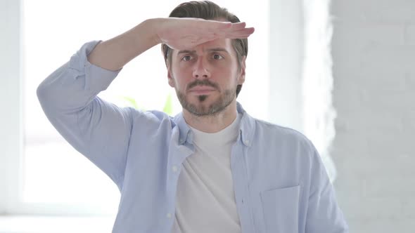 Portrait of Young Man Looking Around Searching