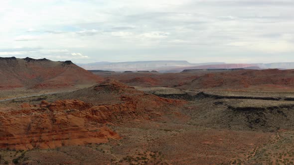 Aerial Drone footage of the mountainous red rocks in southern Utah. Showing the sky, the mountains,