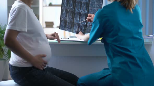 Traumatologist Considering Mri of Back of Pregnant Woman Who Complaints of Pain