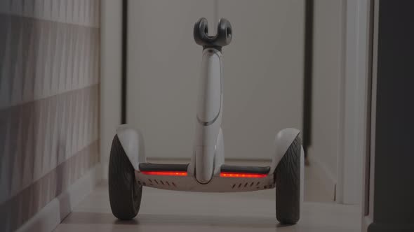 White Modern Gyro Scooter Gadget Balances Itself and Spins with Intelligence Avoids Obstacles in the