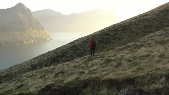 Drone Over Man Hiking Mountains Of Vidareidi