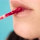 Blurred Lady Applies Lipstick Macro - VideoHive Item for Sale