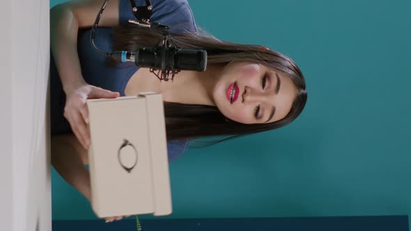 Vertical Video POV of Content Creator Filming Unboxing Video with Package Order