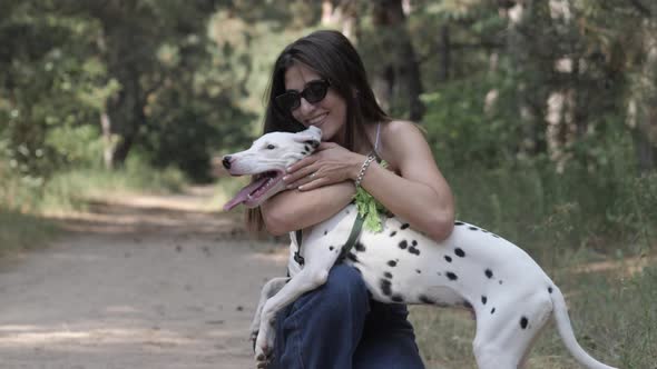 Girl and a Dog Dalmatian