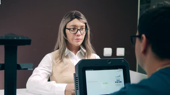 Female Humanlike Cyborg Is Talking To a Man